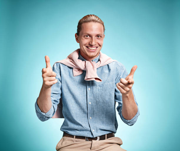 istock Happy excite young man smiling over blue background 641205062
