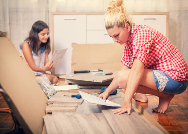 istock Young Family Assembling Furniture 641206210