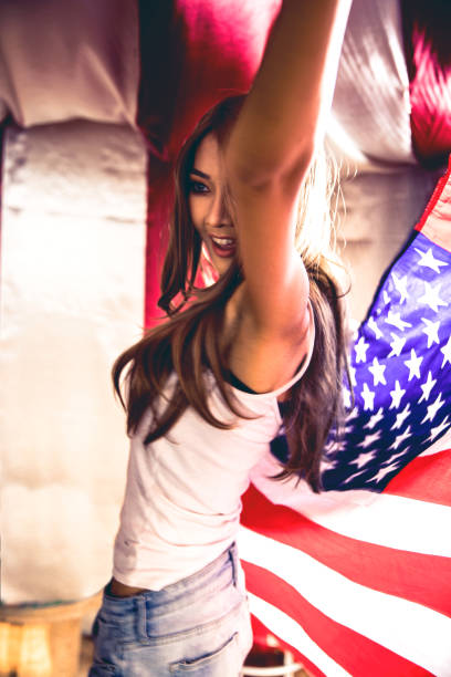 istock Woman celebrate with american flag 641206278