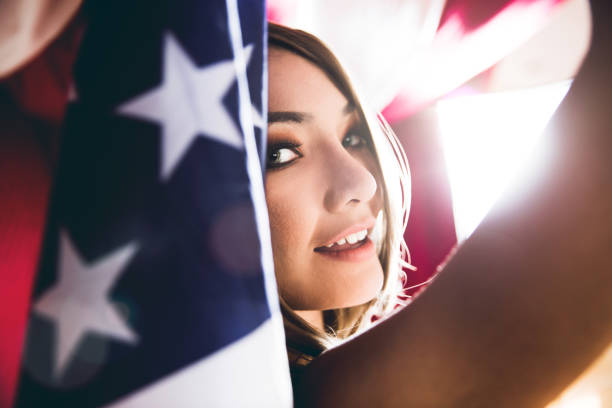 istock Woman celebrate with american flag 641207116