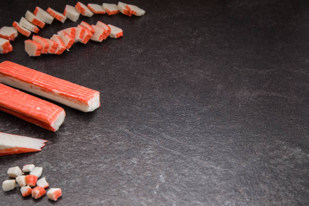 istock Crab sticks on the dark table in the kitchen. 641208288