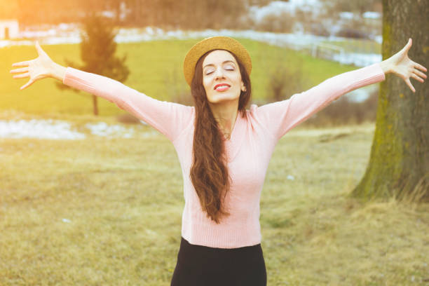 istock woman rising hands up in the nature,spring 641211980