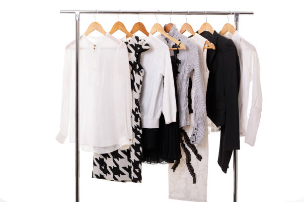 istock black and white womens clothes on hangers on rack on white backg 641213750