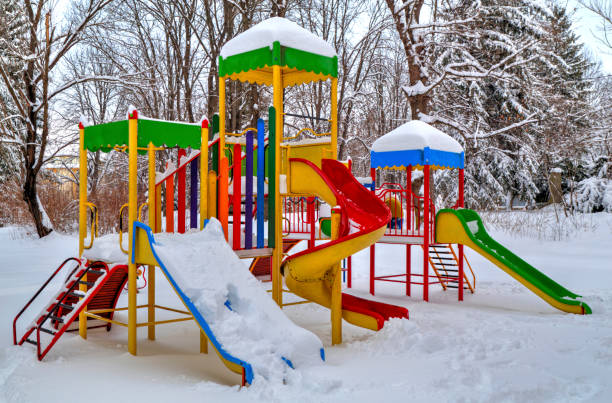 istock Children's playground covered with snow 641214056