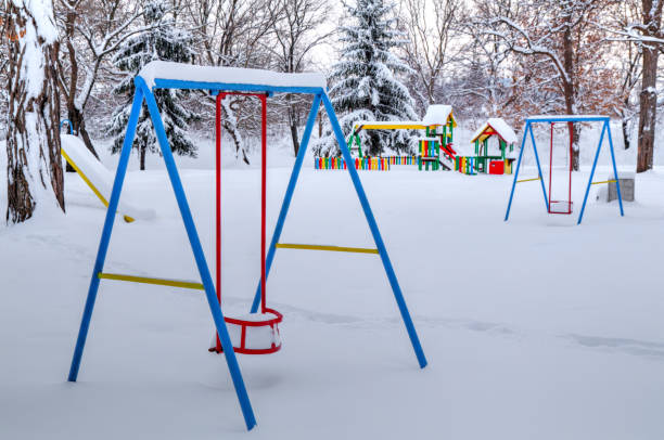 istock Children's playground covered with snow 641214084