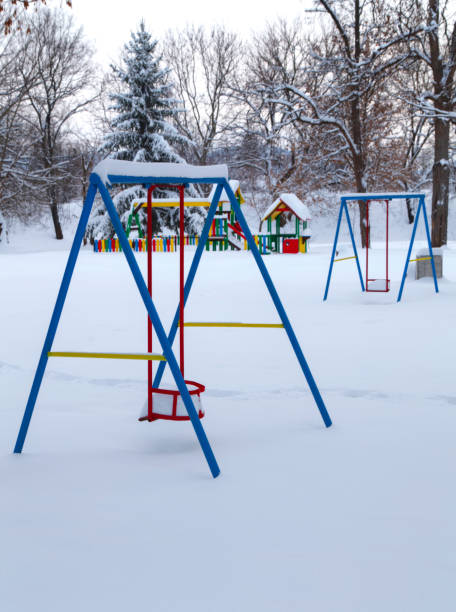 istock Children's playground covered with snow 641214114