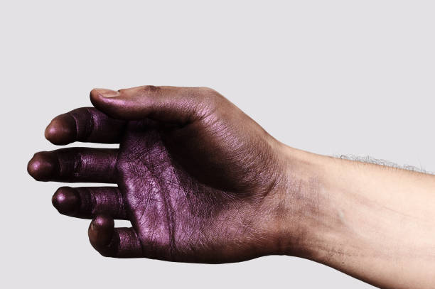 istock Relaxed Hand in purple Paint 641214482