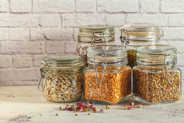 istock Glass jars with various legumes - beans, mung bean, peas and len 641219040