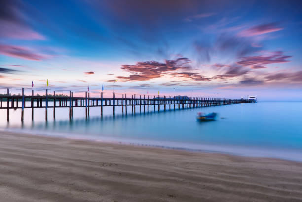 istock Low light of a sea with woode bridge. 641220592