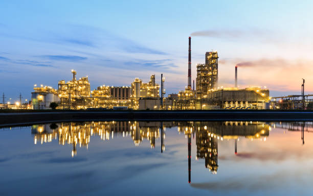 istock Highlighted oil refinery at sunset 641221044