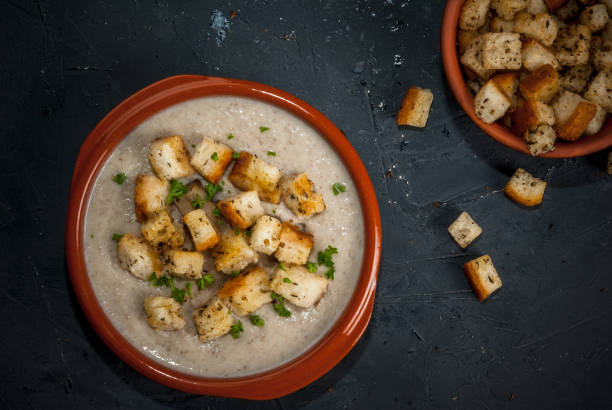 istock Mushroom soup with croutons and herbs 641221340