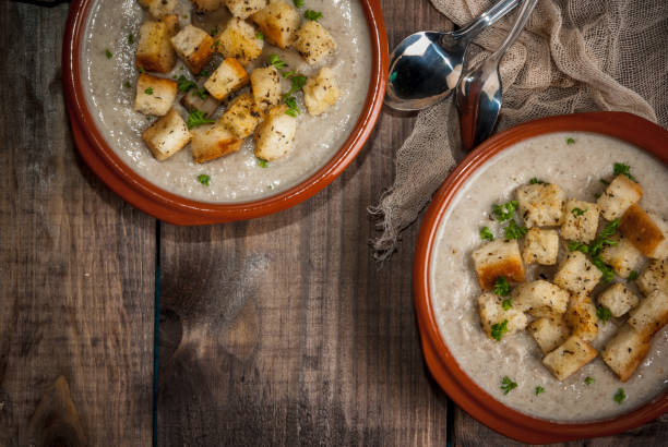 istock Mushroom soup with croutons and herbs 641221346