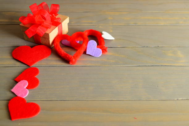 istock Side view of Present with Hearts on wooden Table 641226518