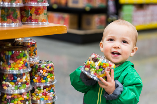 Baby Boy shopping for candies in a supermarket