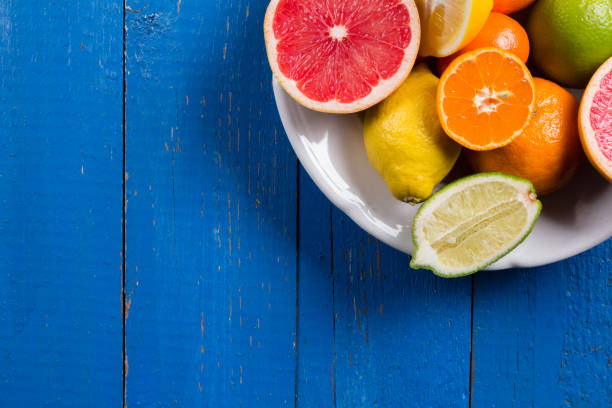 istock various types of citrus fruit on a blue painted wooden background 641229210