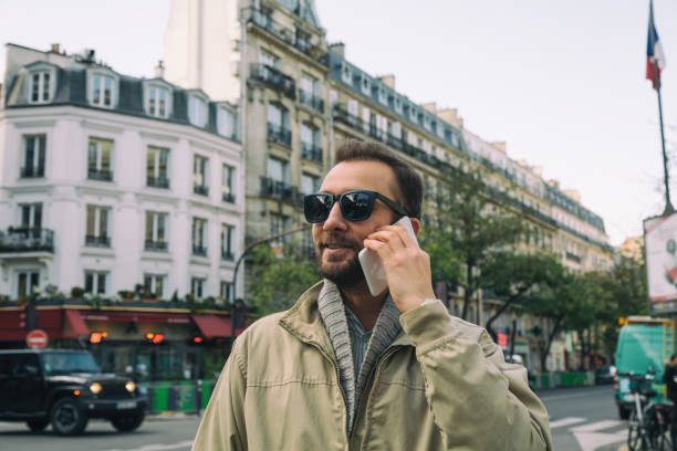 istock Modern guy using smartphone in the European city. 641229688