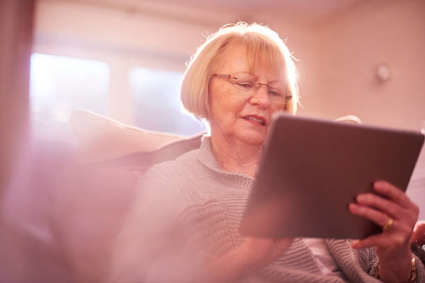 istock senior woman online 641233858