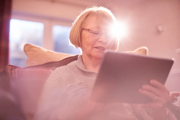 istock senior woman browsing the internet 641234008