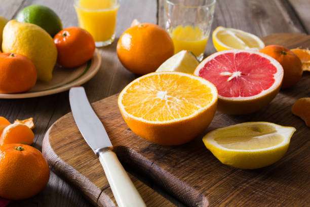 istock various types of citrus fruit on a wooden background 641234026