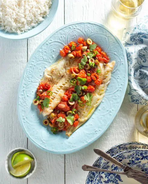 Delicious white fish veracruz with olives, capers, tomato, jalapeno pepper and cilantro.