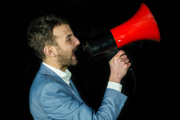 istock Businessman shouting by megaphone 641239318