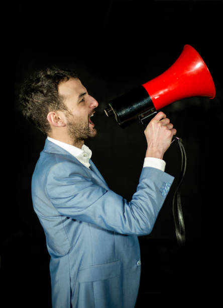 istock Businessman shouting by megaphone 641239548