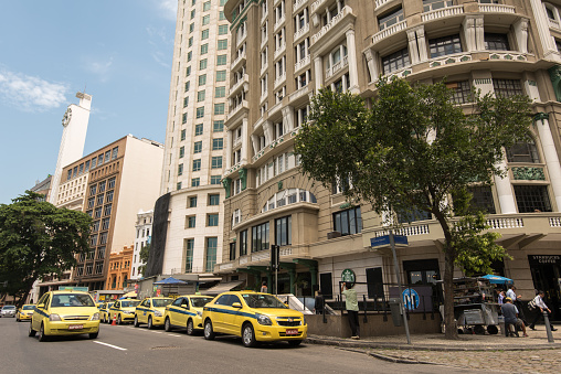 Rio de Janeiro, Brazil - November 22, 2016: Taxi cars parked in a row in the street in Rio de Janeiro city center.