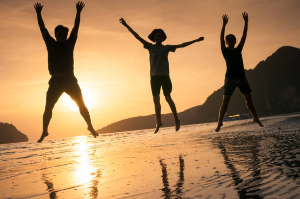 istock happy family walking on the beach 641246378
