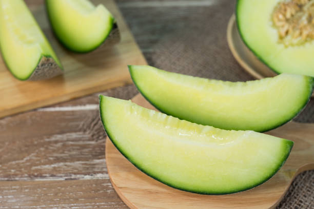 istock Green melon on wooden plate 641246454