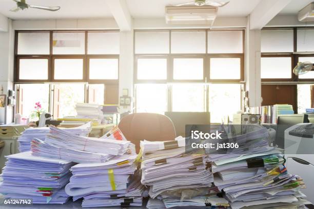 Business Concept Pile Of Unfinished Documents On Office Desk Stock Photo - Download Image Now