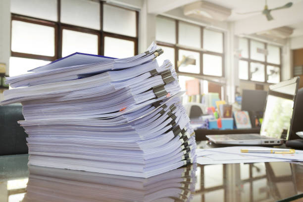 istock Business Concept, Pile of unfinished documents on office desk 641247162