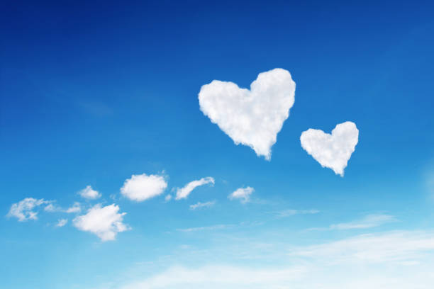 istock couple white heart shaped clouds on blue sky 641247184