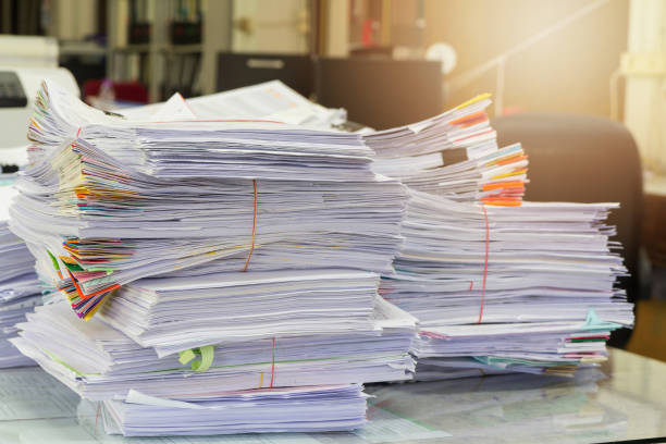 istock Business Concept, Pile of unfinished documents on office desk 641247188