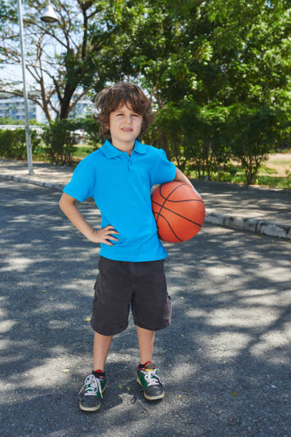 istock Little basketball player in park 641249144