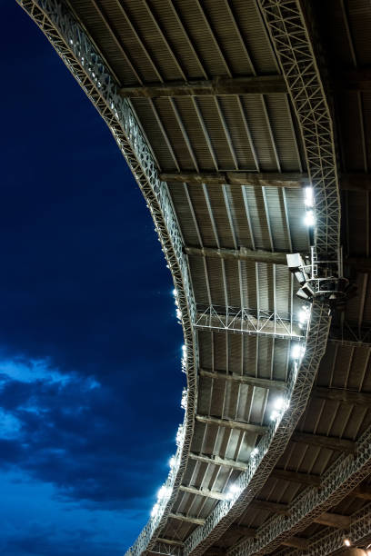 istock stadium soccer roof at night game with copy space 641249224