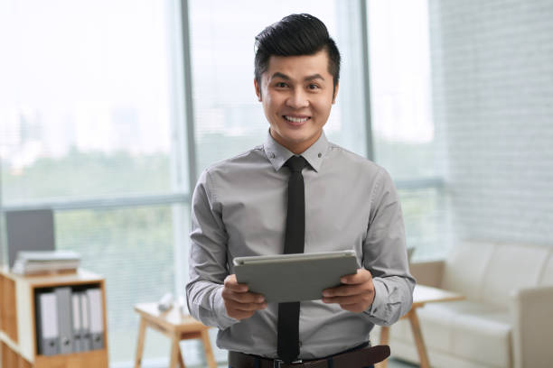 istock Cheerful entrepreneur with digital tablet 641249532