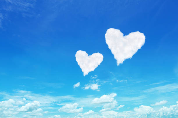 istock couple white heart shaped clouds on blue sky 641249730
