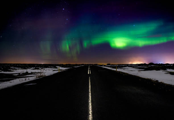 istock Northern Lights over the Road 641250346