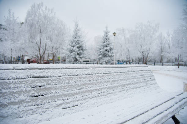 istock Winter street bench city 641252918