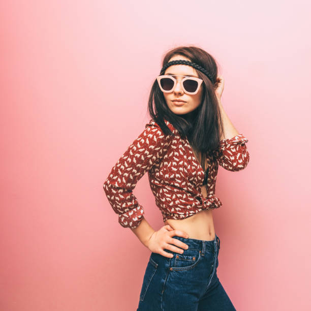 istock lady in a shirt and jeans 641253926