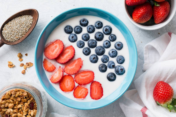 istock Yogurt bowl with strawberries, blueberries and granola 641254274
