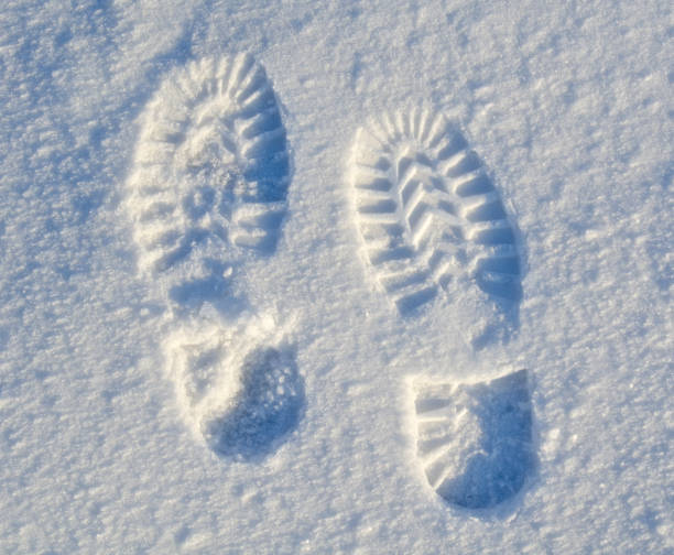 istock foot steps on snow ground on the first snow 641254426