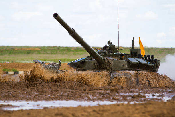 istock Army tank crosses the water obstacle 641254672