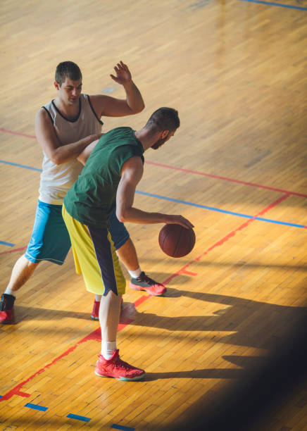 istock Group of friends playing basketball 641255434