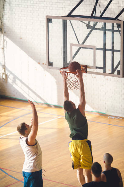istock Group of friends playing basketball 641255474