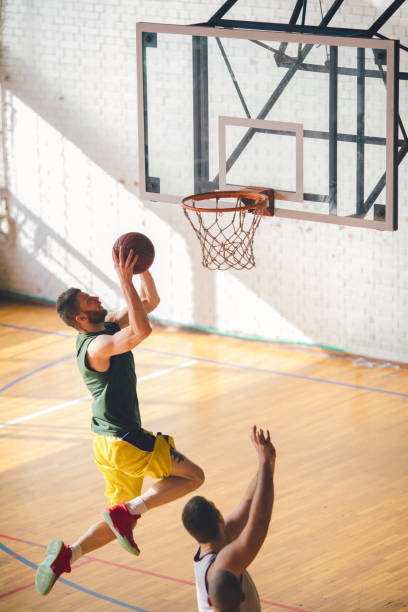 istock Group of friends playing basketball 641255534