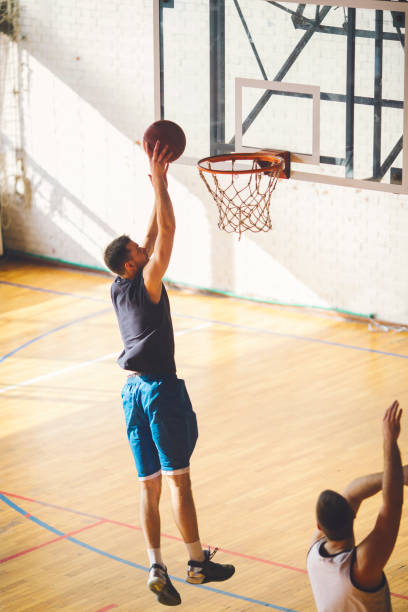 istock Group of friends playing basketball 641255628