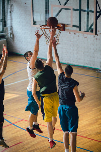 istock Group of friends playing basketball 641255658