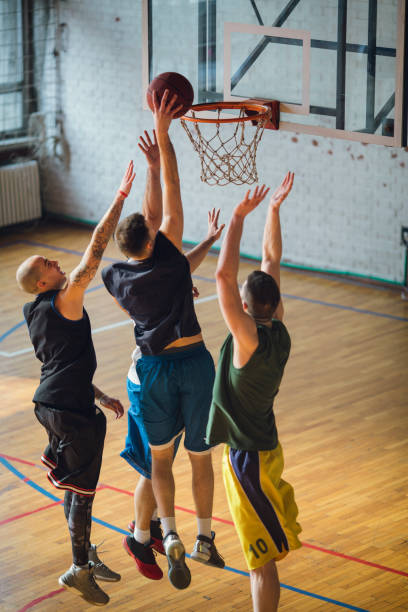 istock Group of friends playing basketball 641255700