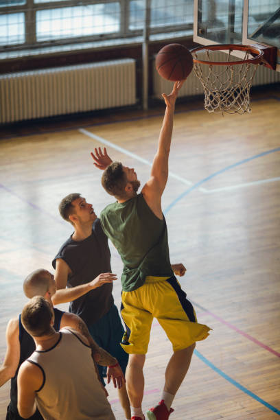 istock Group of friends playing basketball 641255724